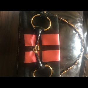 Authentic Gucci hand purse Black and pink color